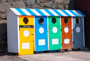Colorful dumpsters . Selective garbage collection