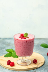 raspberry dessert in glass jar with berries. Yogurt cocktail on a white background. place for text, top view
