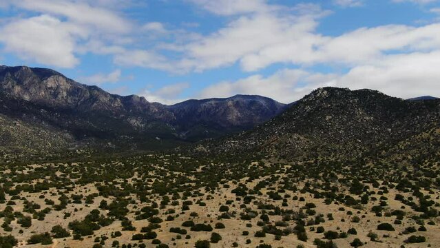 Aerial pan of trails hiking Sandia Mountains Albuquerque New Mexico