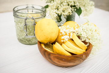 Canned drink with elderberry and lemon. A refreshing summer drink with fresh elderberry flowers