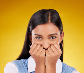 Portrait, wow and excited with a woman on a yellow background in studio looking shocked or in awe....