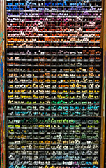 A grid display with various colors of crayons at a art supply store