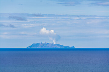 Whakaari/White Island is an active marine volcano that is located 49 kilometres offshore from Whakatane. View from Kohi Point Lookout, Whakatane, New Zealand © Irina-B