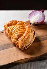 Breakfast of fresh vegetarian croissant with onion