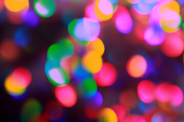 Fototapeta premium Blurred multicolored lanterns of the night city. Aesthetic beautiful photo