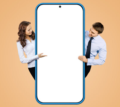 Collage image - businessman, businesswoman stand behind show big cell phone mobile smartphone. Business woman man hold peep overhang cellphone with white mockup screen isolated latte beige background