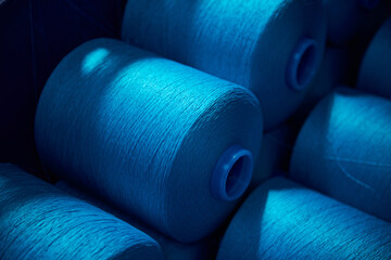 Blue rolls of industrial cotton in  weaving factory, hand weaving cotton for the fashion and...