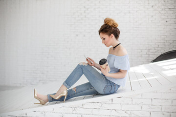 Young smiling business woman using smartphone