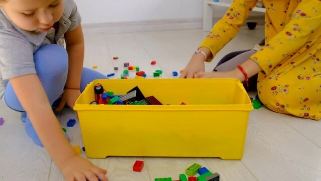 Constructor child plays in the room. Selective focus.