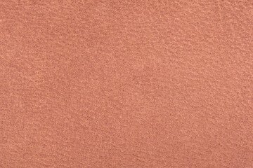 Pale orange leather surface. Visible structure of the material.