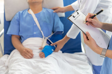 Injured hand. Young man with hand injury. female doctor helping a patient at the hospital