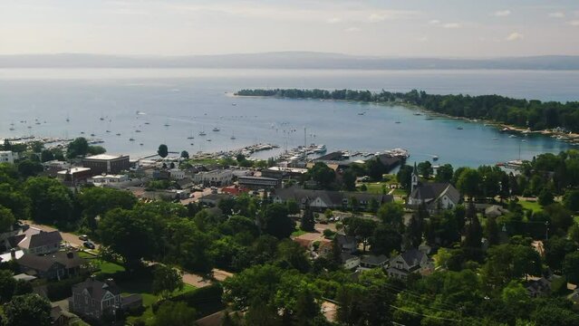 slow pan up aerial Church Harbor Springs Great Lakes Up North Drone forward movement beautiful summer day