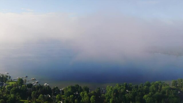 Shoreline boats early morning fog Burt Lake Up North Great Lakes Petosky Harbor Springs Mackinaw cottage farmland forward up movement Michigan