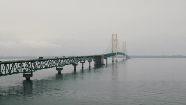 Mackinaw Bridge Fog Rain peaceful cars crossing pan right spin Great Lakes up north Michigan summer