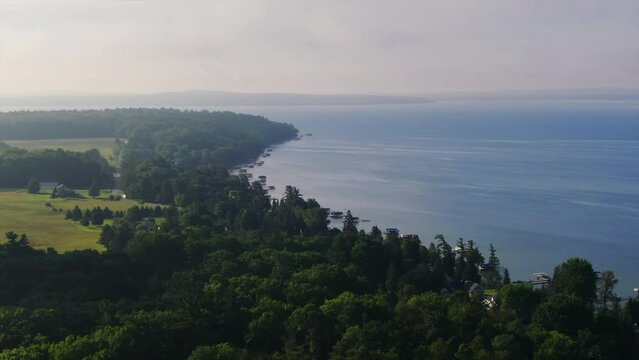 Shoreline early morning fog Burt Lake Up North Great Lakes Petosky Harbor Springs Mackinaw cottage farmland backward movement Michigan