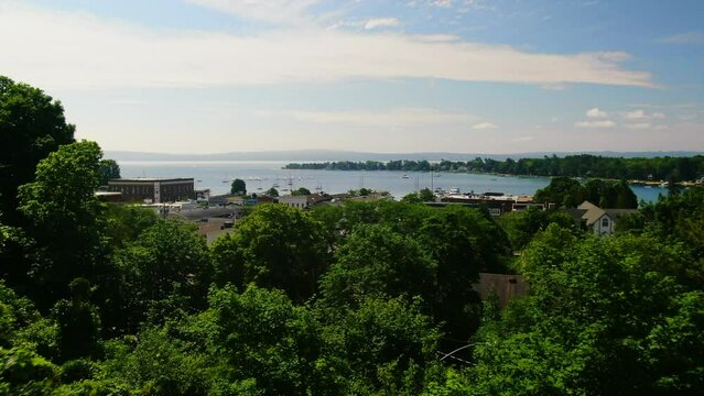 Forward past trees Church Harbor Springs Great Lakes Up North Drone beautiful summer day
