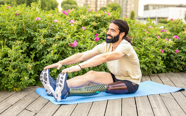 Young man of Hispanic origins with a disability practicing stretching at city park, concept of...