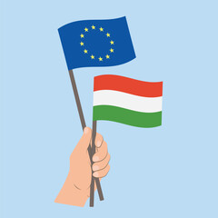 Flags of EU and Hungary, Hand Holding flags