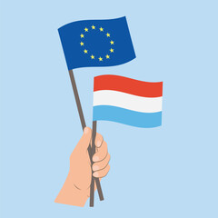 Flags of EU and Luxembourg, Hand Holding flags