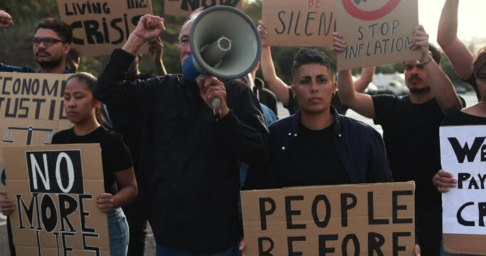 Group of multiracial people protest against inflation and financial crisis - Angry protesters marching for rise cost of living in the city