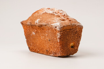 A cupcake with raisins isoalted on a white background.