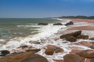 beautiful sunset over the indian ocean with rocks in the foreground sri lanka