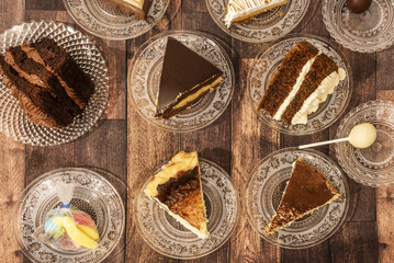 Several portions of chocolate cakes, creams, cheese and sweet jelly beans