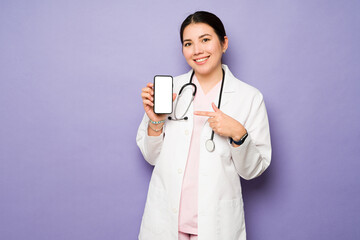 Caucasian female doctor using a smartphone