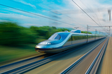 Fototapeta na wymiar Fast modern high speed train speeding through the mountainous landscape.