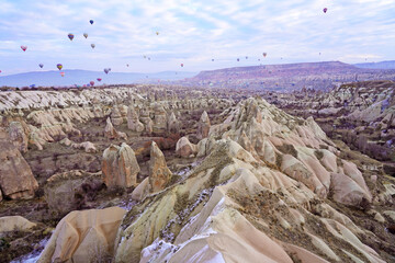 Hot air balloon flying over spectacular Cappadocia, Uchisar - Goreme, Turkey   