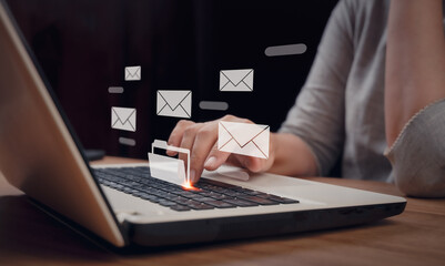 Email marketing, data center and internet advertising concept, inbox, online communication. Person reading e-mail on laptop computer, receive new message with electronic mail icons on virtual screen.