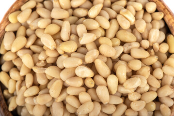 Close-up top view of peeled pine nuts.