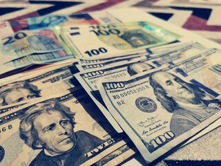 Texture US dollars. Paper banknotes of twenty and one hundred dollars in background