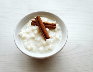  corn hominy in white bowl with cinnamon