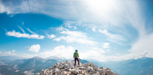 climber goes along the rocky ridge. girl climbing in the mountains. Turkey. the concept of...