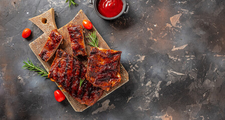 Spicy rack of spare ribs with marinade on a wooden board, banner, menu, recipe place for text, top...