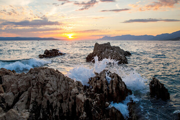 Fototapeta na wymiar Amazing beach sunset with endless horizon and incredible foamy waves.
