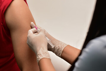 Preventive vaccination The doctor will give the injection to the patient. concept of treatment, prevention, illness