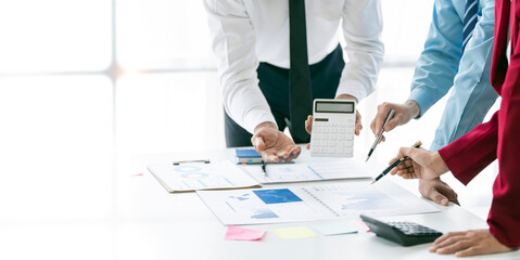 Cropped shot of diverse coworkers working together in boardroom, brainstorming, discussing and analyzing business strategy..