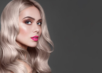 Platinum blonde hair. Beauty portrait of fashion model with stylish make up, pink lips and brown eye shadow. Hair coloring.