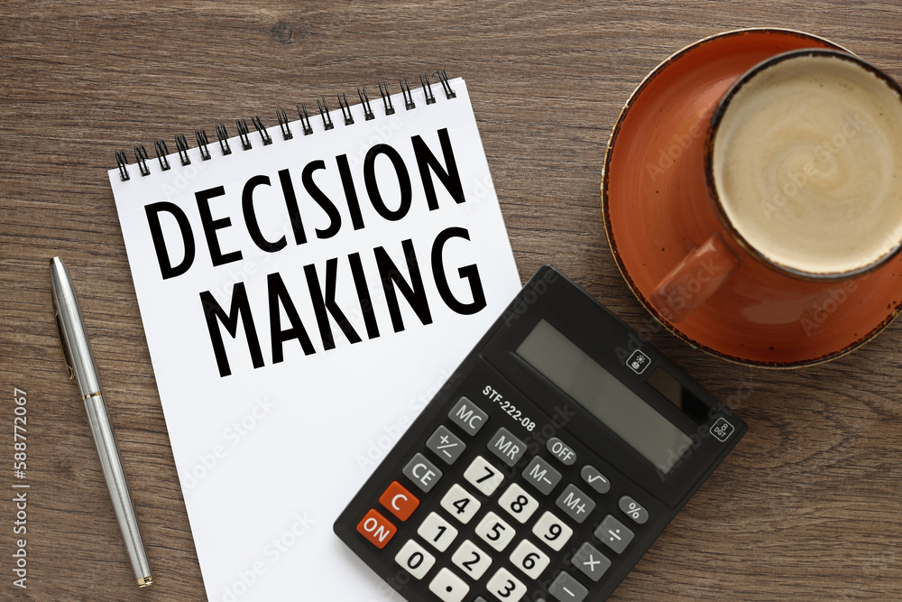 Poster notepad with text near calculator. decision making