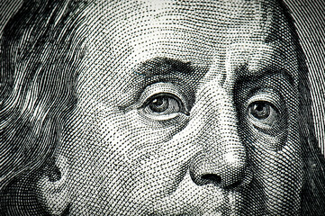 Franklin eyes from dollars as a background