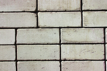 Obraz premium White brick wall as a background for the image.