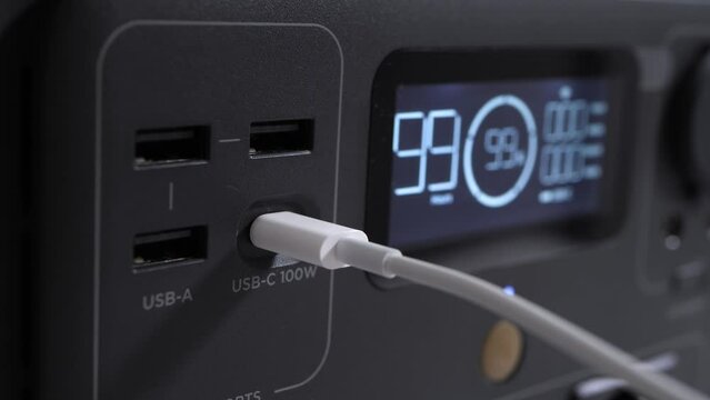 Plugging USB-C into Power Station with Display, Modern Device Connectivity