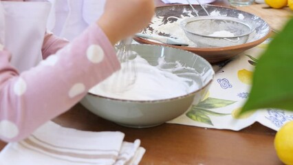 Children Whipping Cream in Deep Pot, Preparing Easter Pastries with Joy

