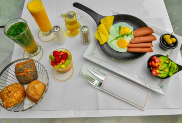 Fototapeta na wymiar A varied Moroccan breakfast, a hot drink, juice, appetizers and bread
