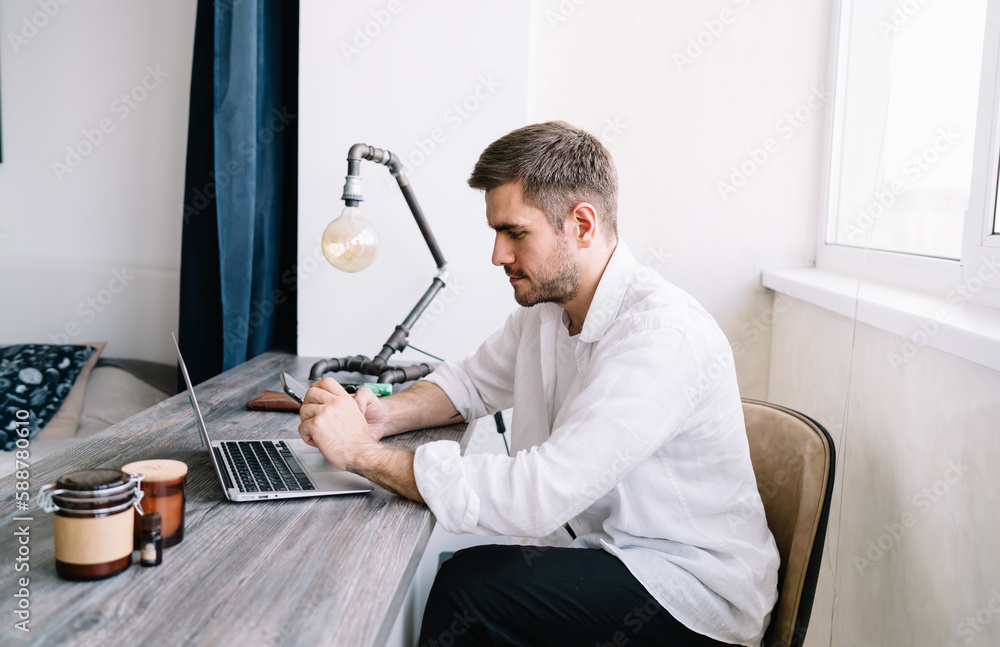 Poster concentrated man searching web information during social networking via smartphone