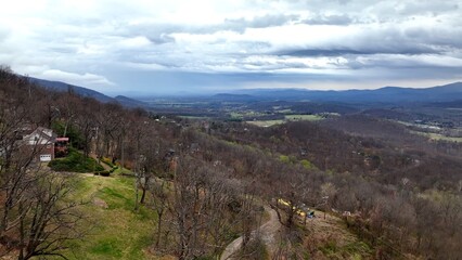 Fototapeta na wymiar House on hillside overlooking valley in Virginia with mountains
