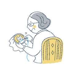 刺繍をしているシニア女性