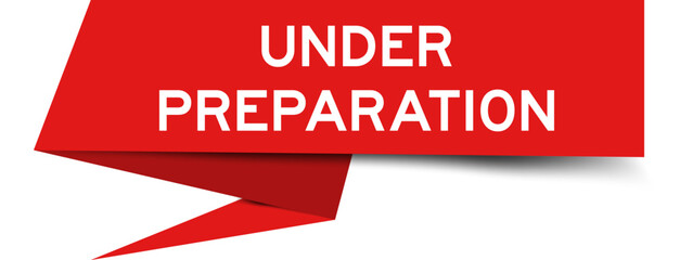 Red color speech banner with word under preparation on white background